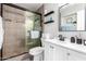 Modern bathroom featuring tiled shower with glass door and a stylish vanity at 5223 W Lewis Ave, Phoenix, AZ 85035