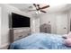 Bedroom featuring wood-look flooring, a ceiling fan with lights, and neutral-toned walls at 5223 W Lewis Ave, Phoenix, AZ 85035