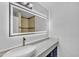 Modern bathroom with an illuminated mirror and decorative vessel sink on quartz countertop at 5942 W Seldon Ln, Glendale, AZ 85302