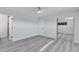 Bedroom with a mirrored closet, ceiling fan, and a doorway to the bathroom at 5942 W Seldon Ln, Glendale, AZ 85302