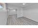 This bedroom features light gray walls, light wood floors, a ceiling fan and a mirrored closet at 5942 W Seldon Ln, Glendale, AZ 85302