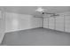 Large two car garage with newly painted walls and floors at 5942 W Seldon Ln, Glendale, AZ 85302