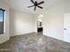 Spacious main bedroom with tiled floors, ceiling fan, and ensuite bathroom at 6202 E Mckellips Rd # 227, Mesa, AZ 85215