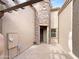 Inviting front entrance features a stone accent wall, wood pergola, and a custom security door at 6202 E Mckellips Rd # 227, Mesa, AZ 85215