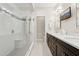 Bathroom featuring a glass-enclosed shower, double vanity, and modern lighting at 7504 N Via De La Siesta --, Scottsdale, AZ 85258