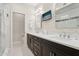 Bathroom with dual vanities, sleek hardware, recessed lighting, and a TV at 7504 N Via De La Siesta --, Scottsdale, AZ 85258