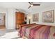 Bedroom with artwork, wood furniture, a ceiling fan, and gray carpet at 7504 N Via De La Siesta --, Scottsdale, AZ 85258