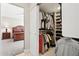 Walk-in closet with shelving, hanging rods, and access to bedroom at 7504 N Via De La Siesta --, Scottsdale, AZ 85258