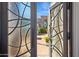 Elegant wrought iron double doors offering a glimpse into a beautiful courtyard and home beyond at 7504 N Via De La Siesta --, Scottsdale, AZ 85258