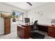 Well-lit home office featuring a modern wood desk and a comfortable office chair at 7504 N Via De La Siesta --, Scottsdale, AZ 85258