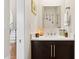 Powder room with dark wood vanity, white countertop, and decorative mirror at 7504 N Via De La Siesta --, Scottsdale, AZ 85258