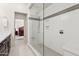 Bright bathroom featuring a glass shower with a gray tile accent stripe and bench seat at 7504 N Via De La Siesta --, Scottsdale, AZ 85258