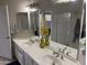 Bathroom featuring dual sinks, a large mirror, and decorative lighting at 7887 N 16Th St # 227, Phoenix, AZ 85020