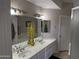 Bathroom featuring dual sinks, a large mirror, and decorative lighting at 7887 N 16Th St # 227, Phoenix, AZ 85020