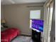 Bedroom with sliding glass doors, a TV, and a comfortable bed at 7887 N 16Th St # 227, Phoenix, AZ 85020