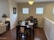 Bright dining area with a dark wood table and chairs, complemented by natural light and modern decor at 7887 N 16Th St # 227, Phoenix, AZ 85020