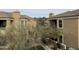 Exterior view between two units showing neutral-colored wall paint and landscaping at 7887 N 16Th St # 227, Phoenix, AZ 85020