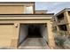 Open garage door on this home shows that the garage is full of bicycles and miscellaneous items at 7887 N 16Th St # 227, Phoenix, AZ 85020