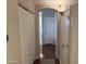 Well-lit hallway with hardwood floors and arched entryway providing access to other parts of the home at 7887 N 16Th St # 227, Phoenix, AZ 85020