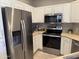 Kitchen features stainless steel appliances, white cabinetry, and modern countertops at 7887 N 16Th St # 227, Phoenix, AZ 85020