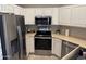 Well-equipped kitchen featuring stainless steel appliances and white cabinetry at 7887 N 16Th St # 227, Phoenix, AZ 85020