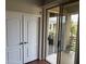 This tiled patio has an ornamental plant and views of the neighborhood beyond the railing at 7887 N 16Th St # 227, Phoenix, AZ 85020