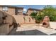 Private backyard with a brick fireplace, perfect for entertaining and enjoying outdoor living at 8134 W Beck Ln, Peoria, AZ 85382