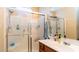 Bright bathroom featuring tiled walk-in shower and vanity at 8134 W Beck Ln, Peoria, AZ 85382