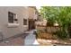 Exterior view showing the backyard, patio, outdoor kitchen, and landscaping at 8134 W Beck Ln, Peoria, AZ 85382