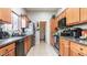 Functional kitchen featuring granite counters, stainless steel appliances and tile floors at 8134 W Beck Ln, Peoria, AZ 85382