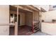 Charming covered patio featuring a stained wood deck perfect for relaxing or entertaining guests at 8134 W Beck Ln, Peoria, AZ 85382