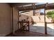 Back patio featuring a brick wall and wood deck at 8134 W Beck Ln, Peoria, AZ 85382