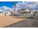 The backyard with a tall palm tree provides privacy and shade for outdoor activities and relaxation at 8248 W Whitton Ave, Phoenix, AZ 85033