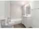 Bathroom featuring a bathtub-shower combo with marbled tile surround, vinyl floors, and a modern vanity at 8248 W Whitton Ave, Phoenix, AZ 85033