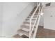 Carpeted staircase with white painted walls and railing leading to the upper level of the home at 8248 W Whitton Ave, Phoenix, AZ 85033