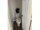 Powder room showcases a toilet, a door and minimal decor at 8648 W Fargo Dr, Peoria, AZ 85382