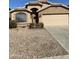 A view of the home's exterior featuring a front yard with desert landscaping at 8648 W Fargo Dr, Peoria, AZ 85382