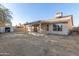 View of the backyard with a storage shed at 8709 W Roanoke Ave, Phoenix, AZ 85037