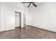 Large bedroom features closet and ceiling fan at 8709 W Roanoke Ave, Phoenix, AZ 85037