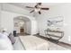 Bedroom featuring neutral tones, arched doorway, and open closet at 8709 W Roanoke Ave, Phoenix, AZ 85037