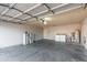 Spacious two-car garage featuring a washer, dryer and water heater at 8709 W Roanoke Ave, Phoenix, AZ 85037