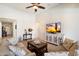 Comfortable living room featuring tile floors, neutral walls, and a stylish entertainment center at 9010 W Ruth Ave, Peoria, AZ 85345