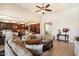 Bright and airy living space connects to a modern kitchen and dining area, perfect for entertaining at 9010 W Ruth Ave, Peoria, AZ 85345