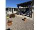 Cozy backyard patio with a pergola, a gravel ground, and outdoor seating for relaxation and entertainment at 9231 W Elkhorn Dr, Sun City, AZ 85351