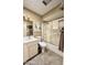 Traditional-style bathroom featuring a tub-shower combo with a tan single sink vanity at 9231 W Elkhorn Dr, Sun City, AZ 85351