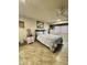 This bedroom features neutral walls, a ceiling fan, and tile flooring for a cool and comfortable space at 9231 W Elkhorn Dr, Sun City, AZ 85351