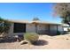 Charming single-story home with a front porch and well-maintained desert landscaping at 9231 W Elkhorn Dr, Sun City, AZ 85351