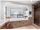 Luxurious bathtub nestled under an arch and a glass blocked window, perfect for relaxation at 10105 E Larkspur Dr, Scottsdale, AZ 85260