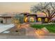 Charming home with a beautifully landscaped yard and inviting entrance at 10105 E Larkspur Dr, Scottsdale, AZ 85260