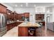 Spacious kitchen features custom cabinets, stainless steel appliances, and an island with countertop seating at 10105 E Larkspur Dr, Scottsdale, AZ 85260